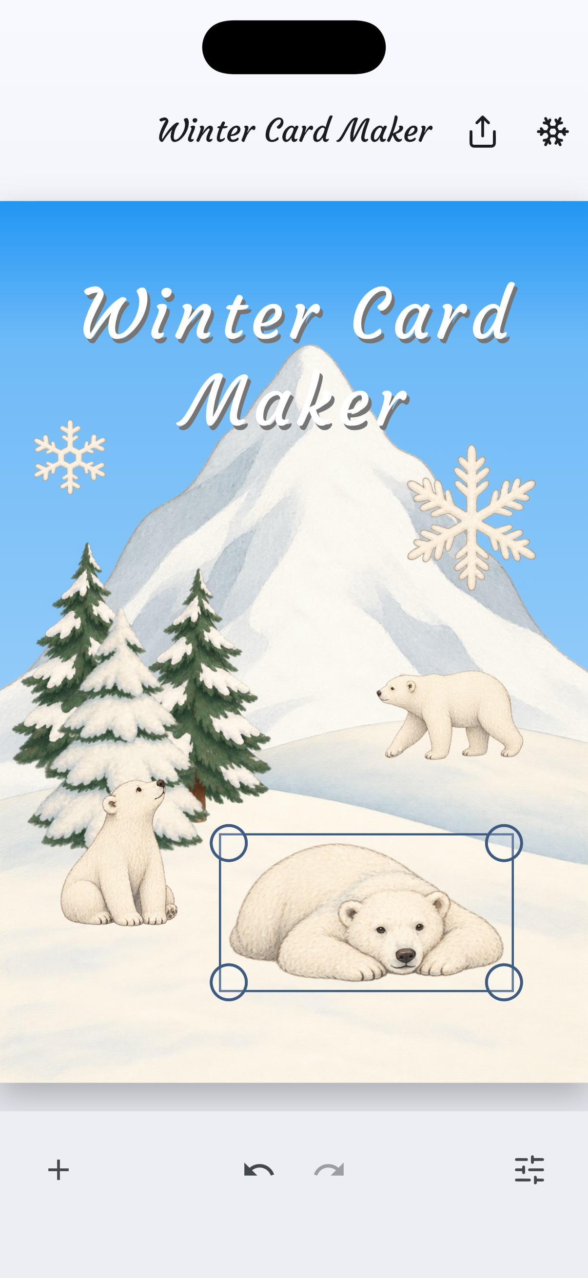 A winter card with the reclining polar bear selected, showing move and resize handles.